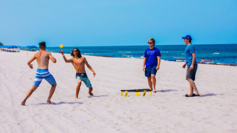 Students playing a game on the beach in Delray Beach, Florida.