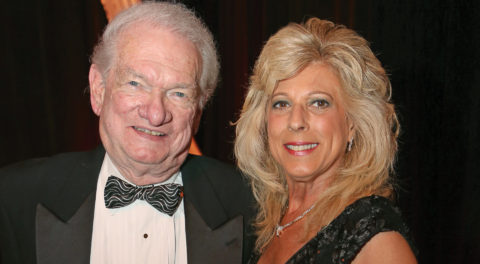 Tom Sliney and Lisa Sliney pose at Christine Lynn's 70th birthday party