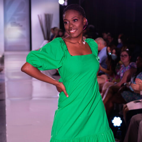 A student walks the runway at the 2022 fashion show.
