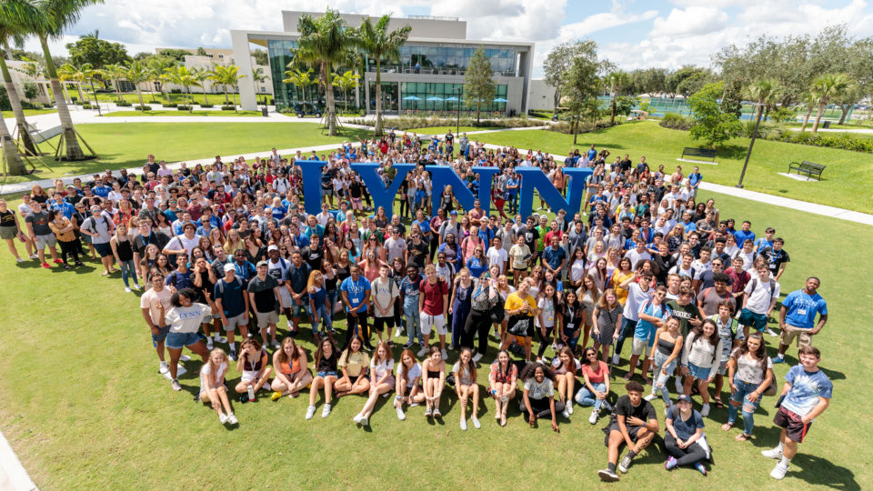 Freshmen pose with life-size Lynn letters in Christine's Park.