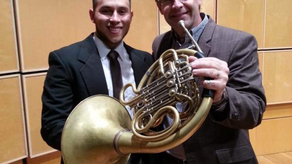 Valverde and Miller holding a French horn
