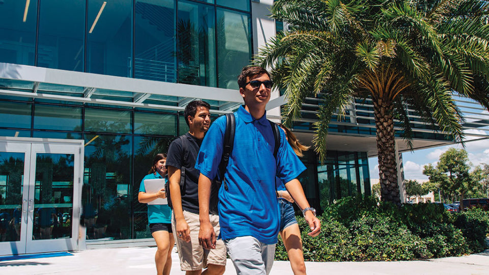 Students walking in front of the international business center.