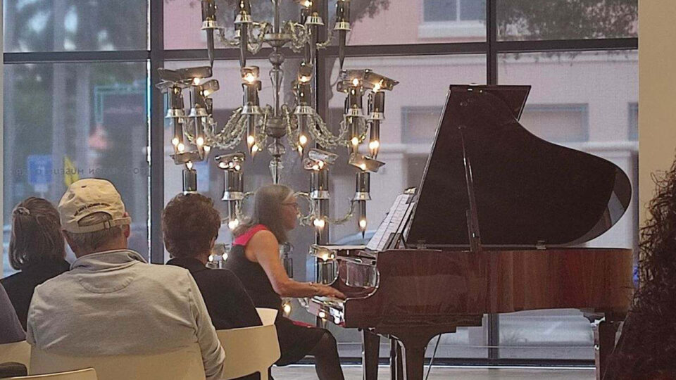 Roberta Rust plays piano at the Boca Raton Museum of Art.