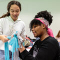 Students making toys for dogs.