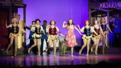 Lynn Drama dances on stage during the production of Crazy for You.