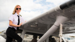Meaghan Dempsey stands in front of a Lynn University Cessna aircraft