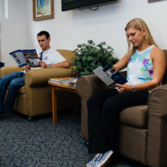 Two students sit in the counseling center.