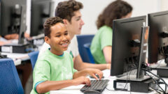 A camper enjoys computer time at Pine Tree Camps.