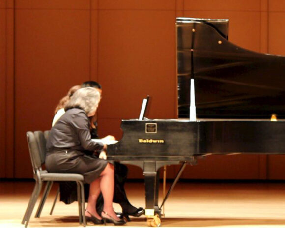 Faculty member teaches piano in the conservatory.