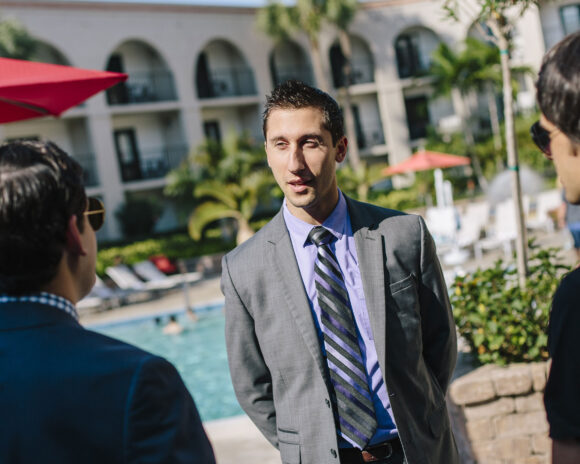Student speaks with resort managers in the mba in hospitality management program.