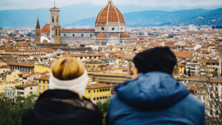 Two students take in a panoramic view of Florence, Italy, from the Piazzale Michelangelo lookout point, just south of the city.