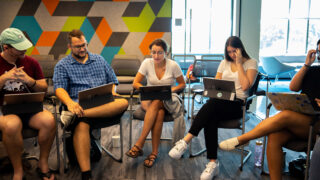 UN Millennium Fellowship students meet in the co-working space of the Social Impact Lab.