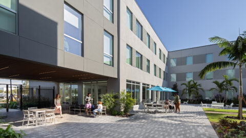 Capstone Apartments courtyard with students enjoying the space.