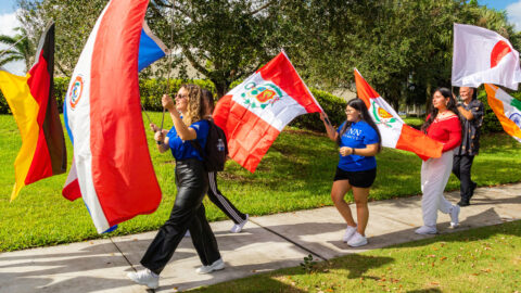 students march during the parade of flags