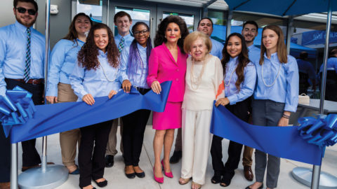 Mary Perper and Christine E. Lynn with students at the opening of Mary and Harold Perper Residence Hall in 2017.