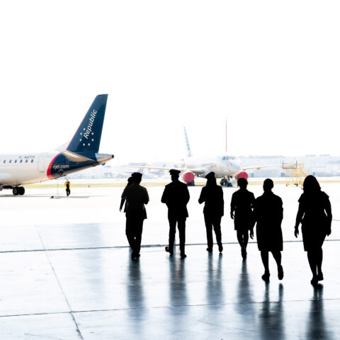 Crew members at Republic Airways walk toward a plane.