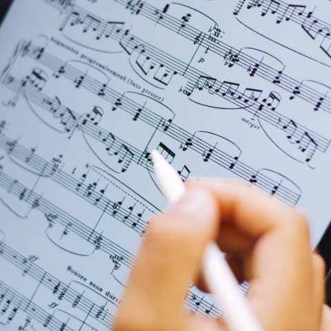 Conservatory student Alfredo composes music on the iPad.