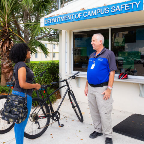 Campus Safety Officer greets student