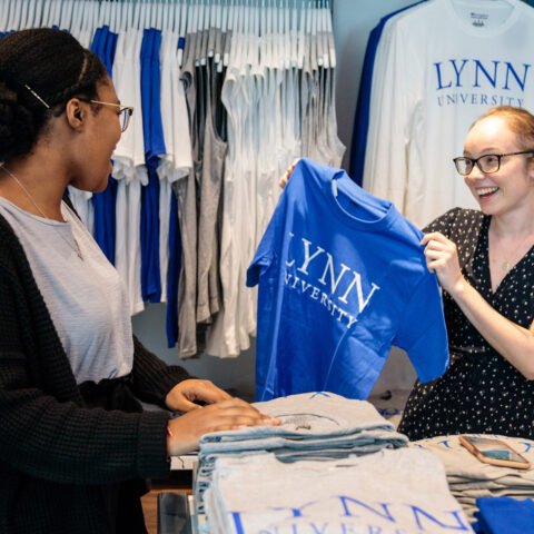 Two students shop at the campus store.