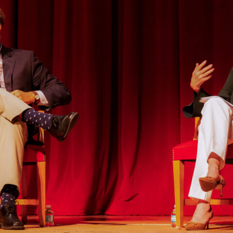 Robert Watson sits on stage with Deborah Oppenheimer at a Dialogues lecture.