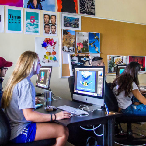 Students taking graphic design classes on Lynn campus.
