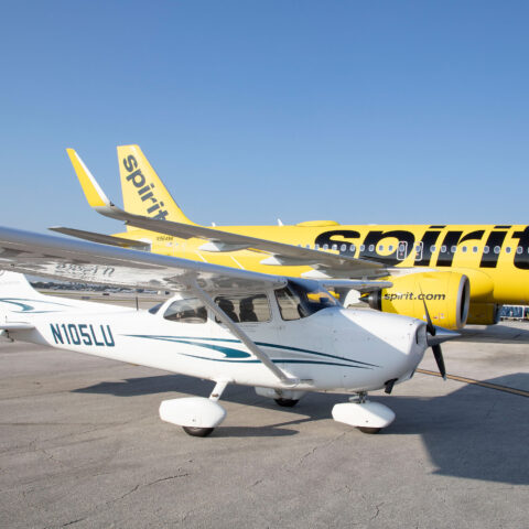 Lynn plane and Spirit plane sit on the tarmac at Boca Raton Airport.