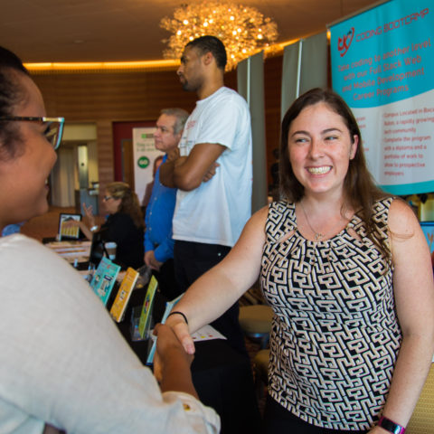 Students meet with employers at the employment fair.