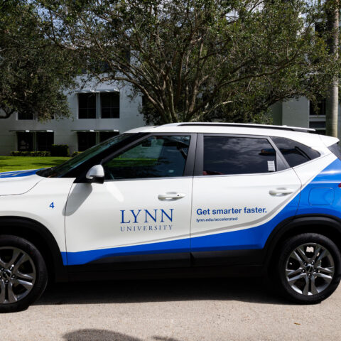 Lynn's Kia car is parked on campus.