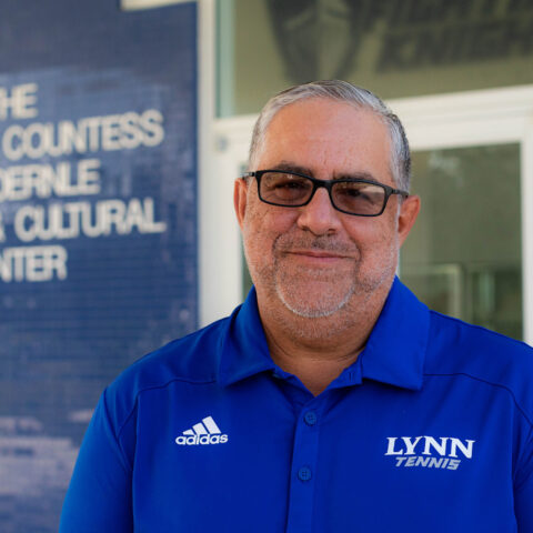 Mike Perez, head coach for men's and women's tennis outside de Hoernle Sports and Cultural Center.
