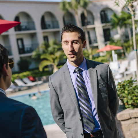 Student speaks with resort managers in the mba in hospitality management program.