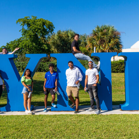 Students pose for the camera as they stand by the Lynn letters in Christine's Park.