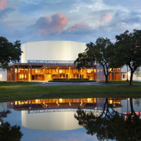 Front of the Wold Performing Arts Center at dusk.