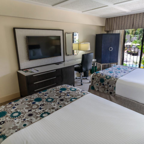 Two full size beds, a TV and a window in a Wyndham hotel room for Lynn University students.