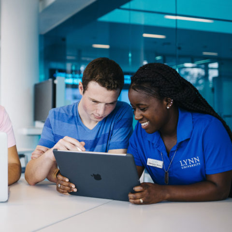 First-year students, undergraduate admission counselors, use iPad Pro on the Lynn University campus.