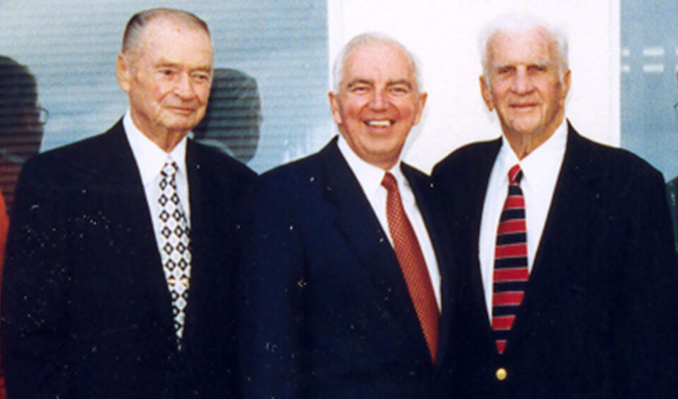 Weldon Case, Donald Ross and Burton Morgan in front of the College of Aeronautics