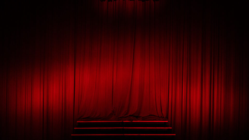 The red curtain at the Keith C. and Elaine Johnson Wold Performing Arts Center