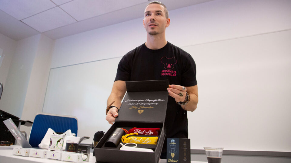 A man presents his work at a product packaging workshop