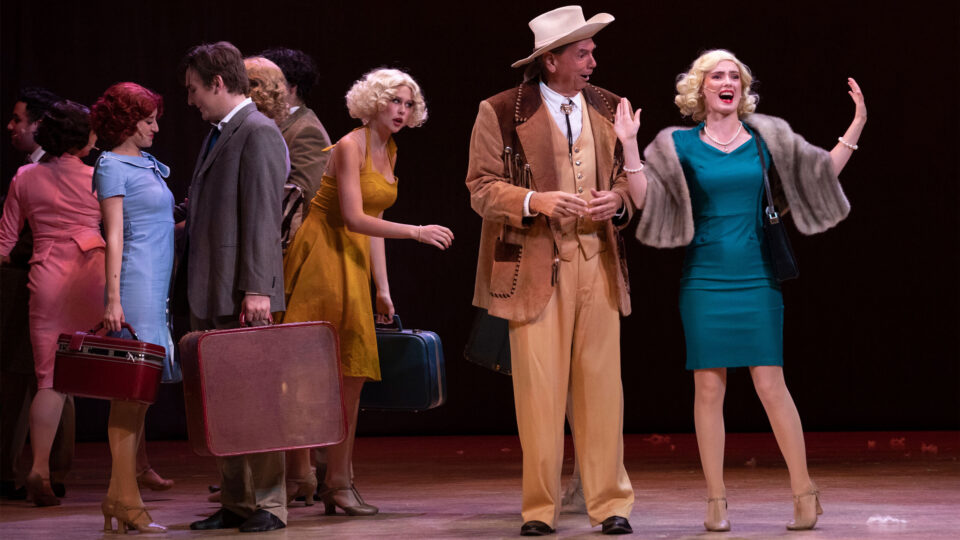 Hannah Hick, drama student, and Jeff Morgan, professor, act together on stage in the production of 42nd Street.