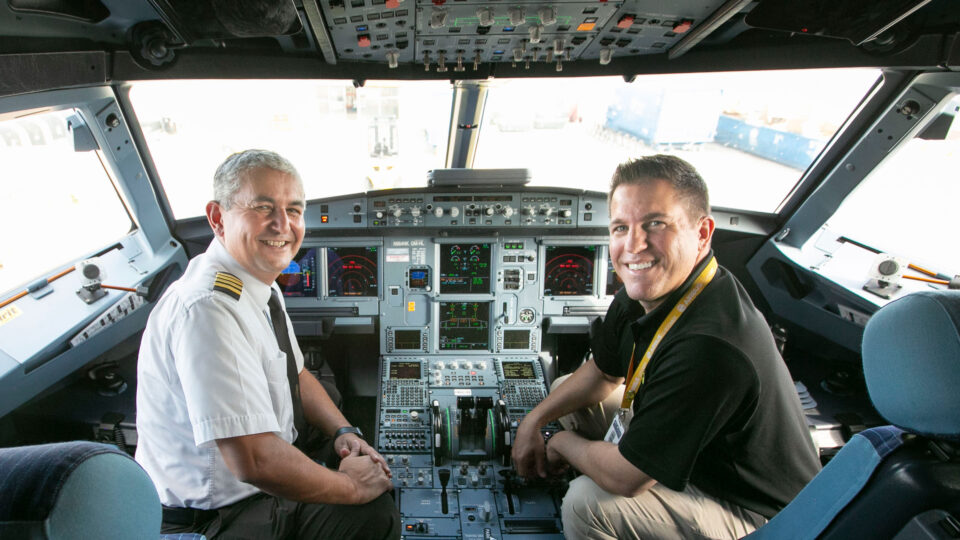 Chief Flight Instructor, Spartak Keshtmand and System Chief Pilot Ryan Rodosta in the cockpit of an aircraft