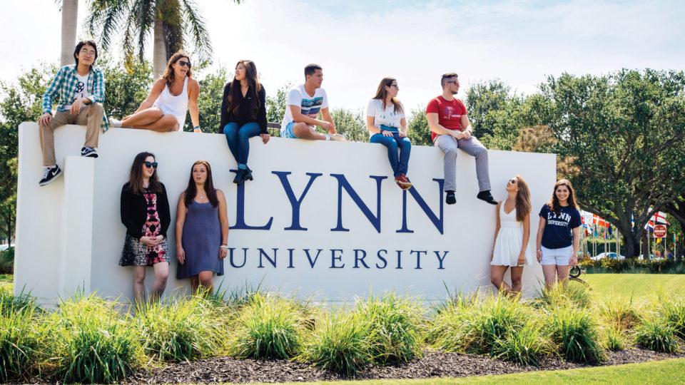 Students by the Lynn sign