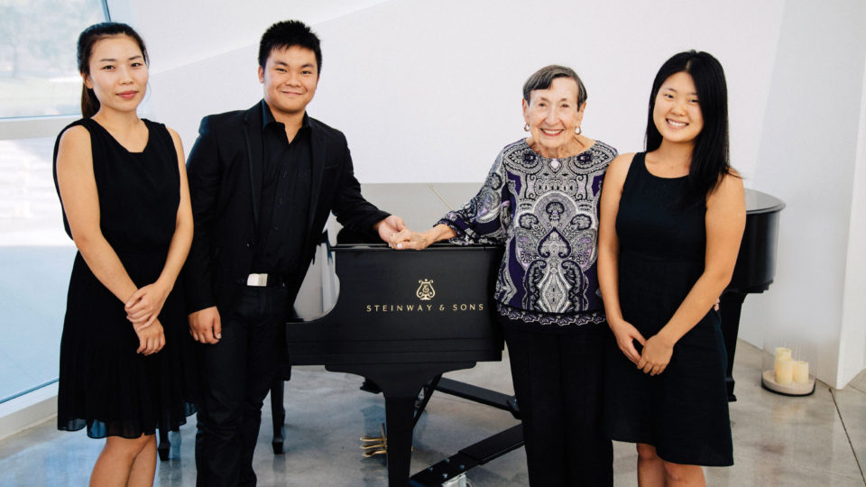 Students with Nettie Birnbach by piano