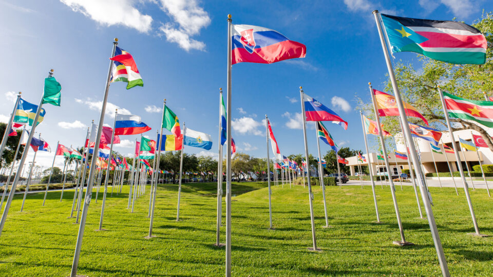 Circle of flags in front of the Schmidt College Center