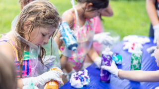 Campers tie-dye T-shirts during a day at Pine Tree Camps.